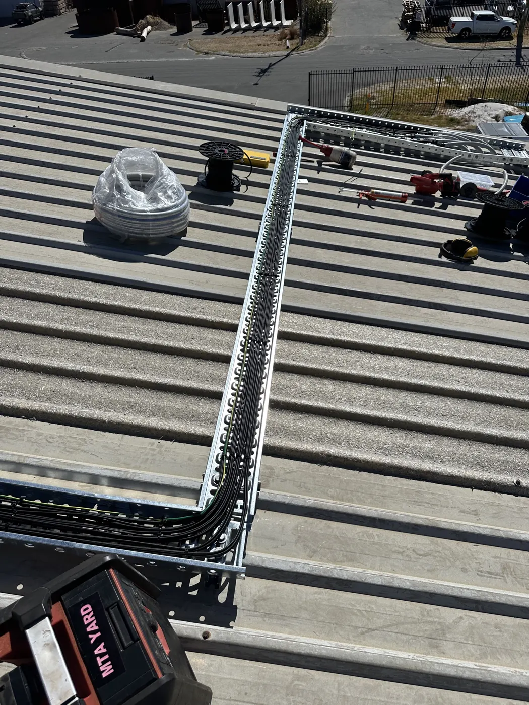 Cable tray and conduit runs on the factory roof