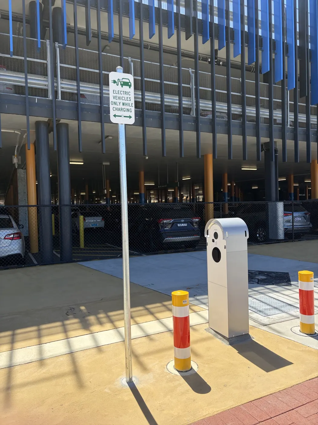 New EV charger with bollards outside the Mandurah Station multi-storey car park