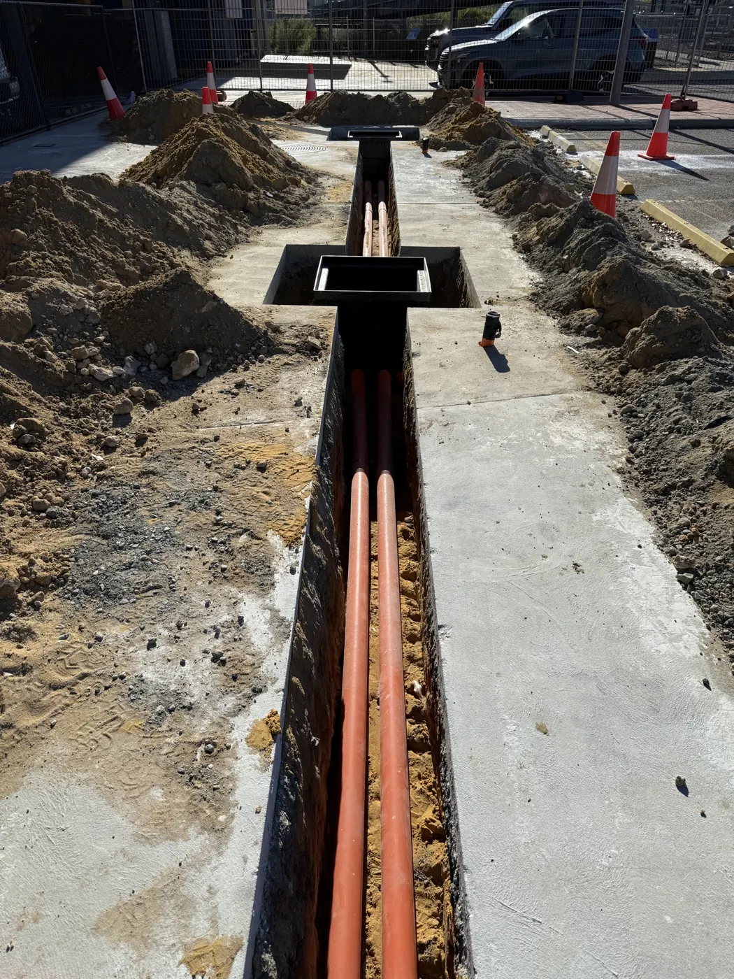 Open trench with conduits for the EV charger supply